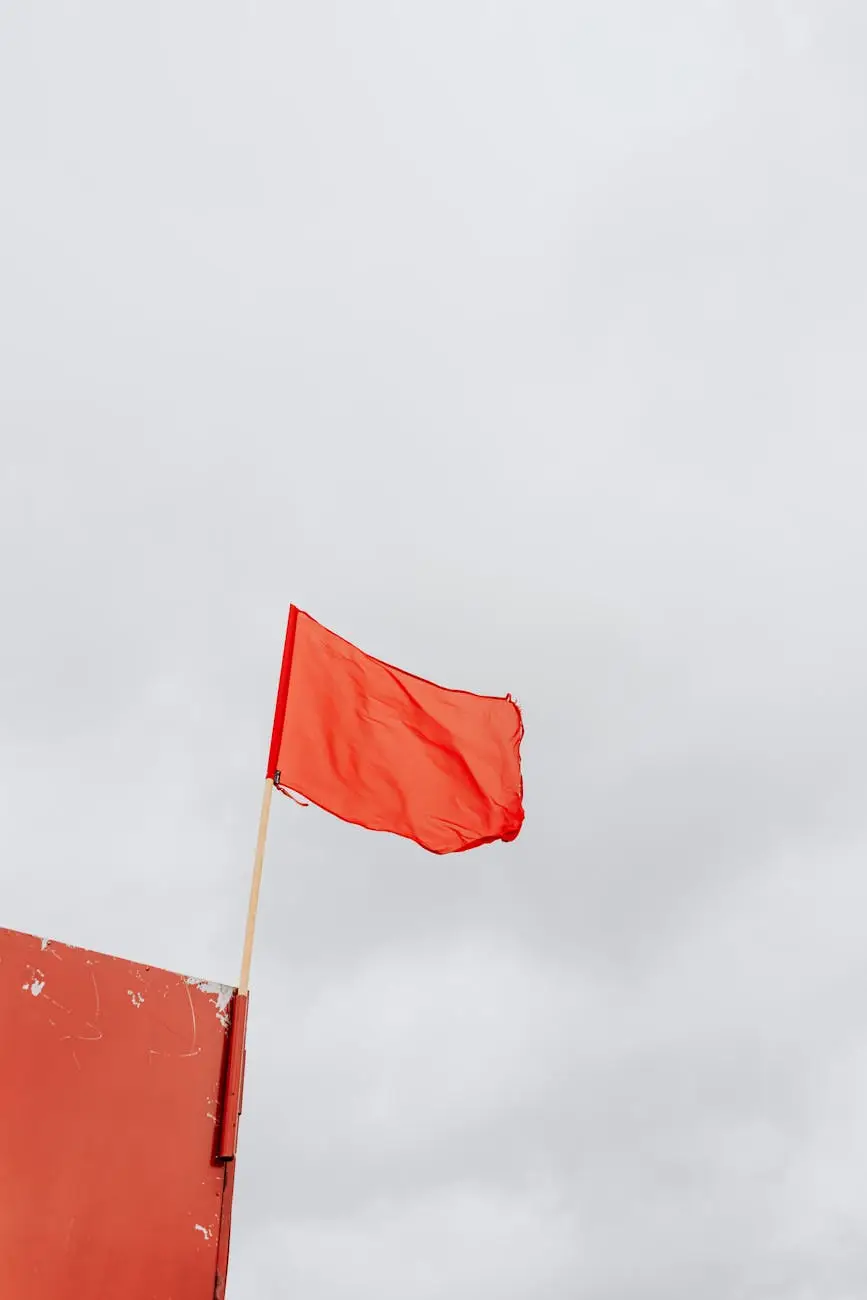 red flag on pole swaying by the wind