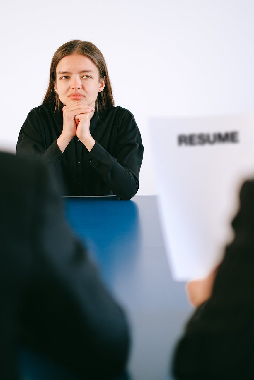 woman in black long sleeve shirt having a job interview