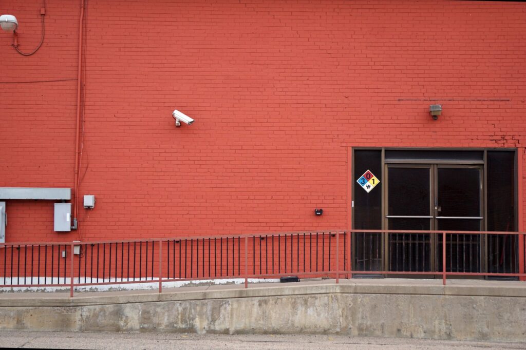 camera on red wall